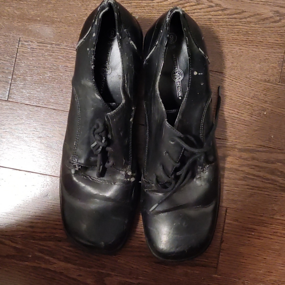 These are black platform high heel shoes.
